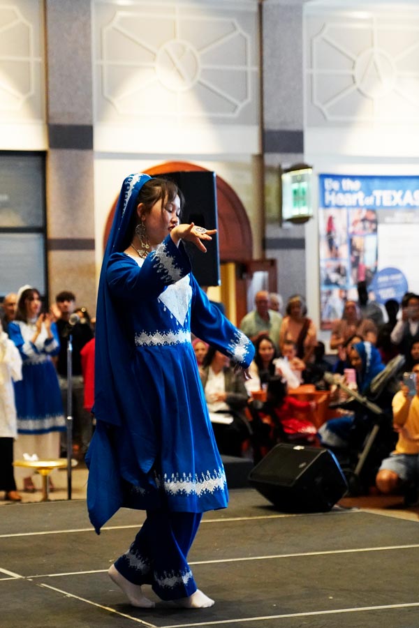 A performer doing a traditional dance at World Refugee Day in the Bullock Museum.