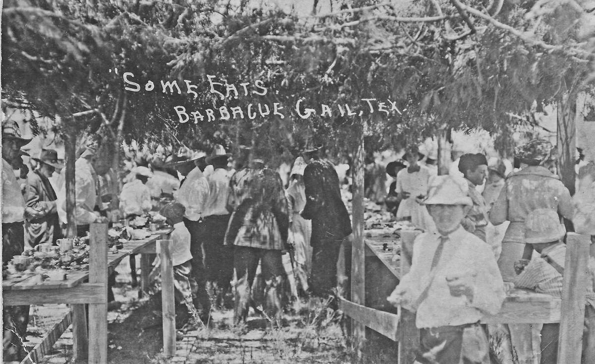 Brush arbor covering barbecue at a Gail three day picnic