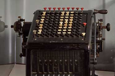 early 1900s adding black adding machine with buttons that stand out from the top