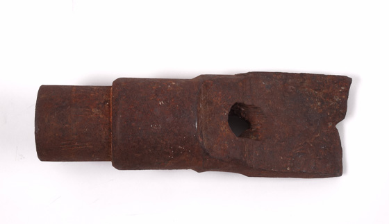 a rusted drill bit in the shape of a fishtail