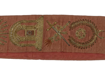 maroon colored sash with golden embroidered Masonic symbols