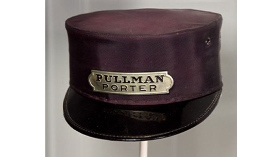 burgundy colored Pullman porter hat with a black rim and a gold plate on the front that reads "pullman porter"