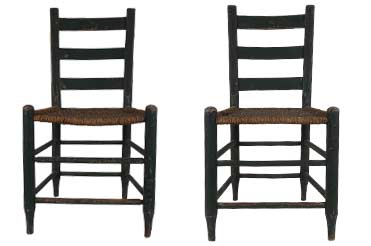 two wooden chairs on a white background