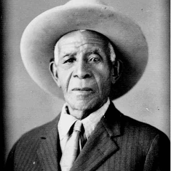 Daniel Webster “80 John” Wallace was born into slavery in 1860. Following emancipation, he left the Fayette County farm of his former enslavers and sought work as a cowboy.  Wallace honed his skills as the right hand to rancher Clay Mann before purchasing his own cattle herd and multiple properties in Mitchell County.  When Wallace died in 1939, he was a respected member of the Texas ranching community and the owner of sixteen properties, including a ranch his family still owns and operates today. Public domain image retrieved from the Texas State Historical Association