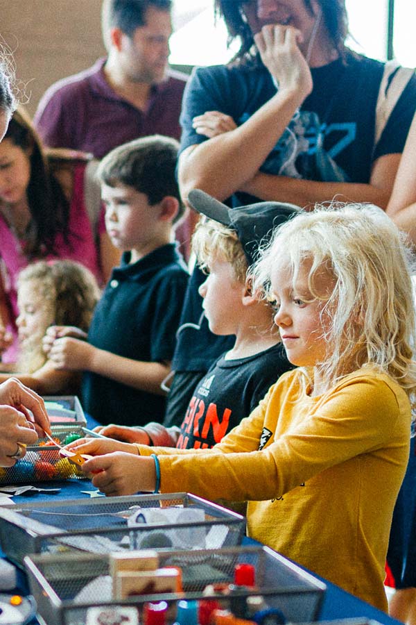 children working on crafts in the Bullock Museum lobby