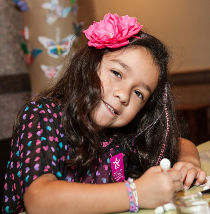 Child coloring with markers