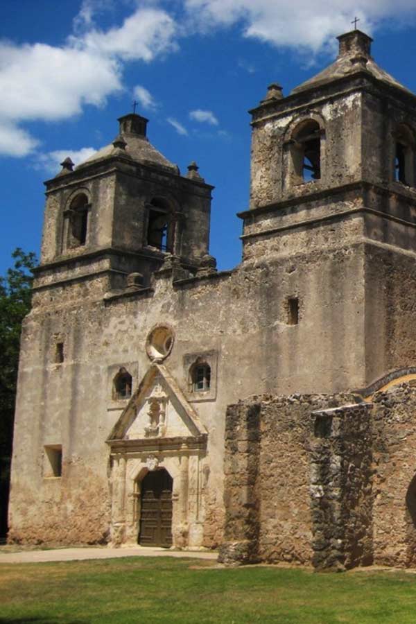 Old stone building with a tower on the left and right side