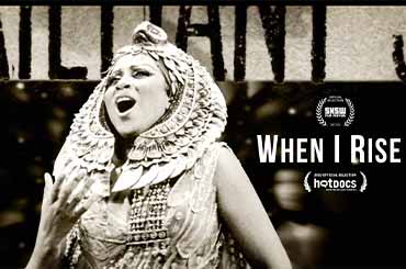 Barbara Smith Conrad wearing an intricate headpiece and singing