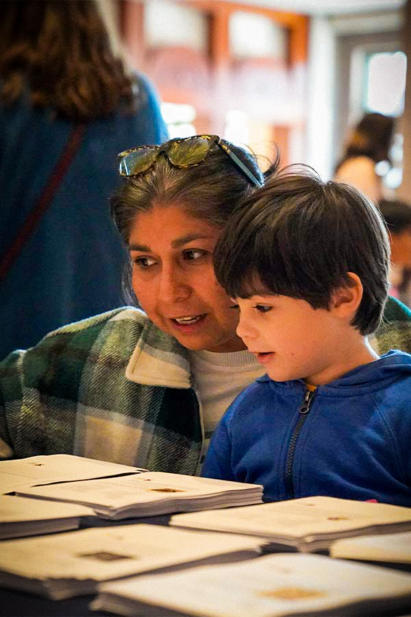 a woman and a kid doing an art activity together in the Bullock Museum