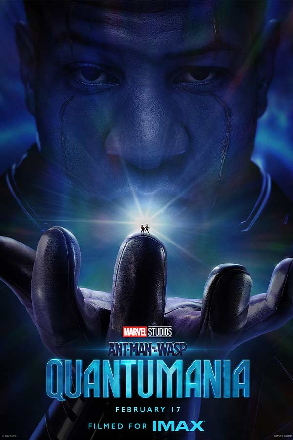 film poster for "Ant-Man and the Wasp: Quantumania" of a man's face holding two very small people