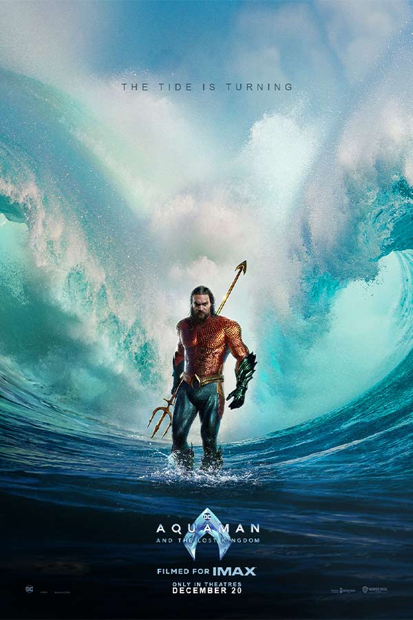 film poster for "Aquaman and the Lost Kingdom" of a man holding a trident standing in front of a giant looming wave 