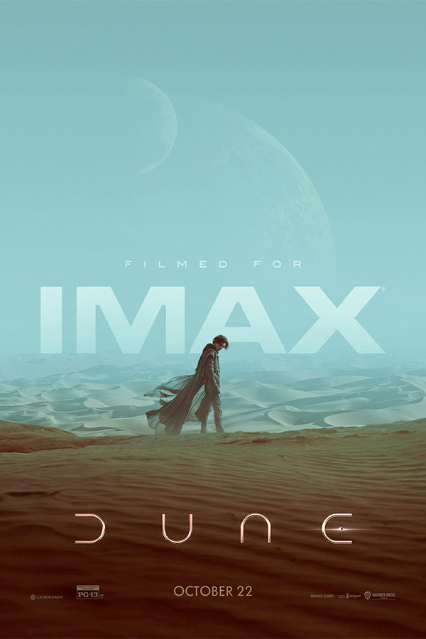 "Dune" film poster of the main character wearing a black cape standing in a vast desert