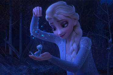 Elsa dropping snowflakes on a small salamander in her hand