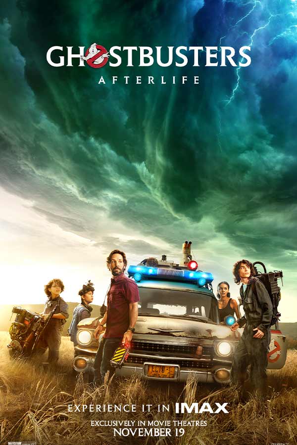 film poster of "Ghostbusters: Afterlife" of a police car in a field, a colorful stormy sky, and five characters looking to the right
