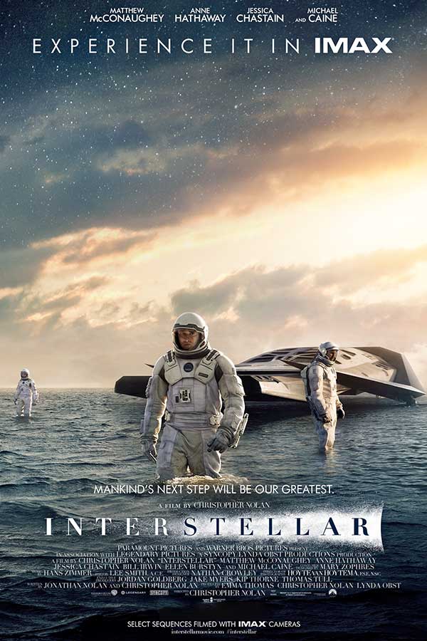 film poster for "Interstellar" three astronauts standing in water with a modern rocketship behind them