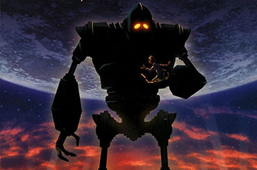 The Iron Giant cradles a boy in his hand