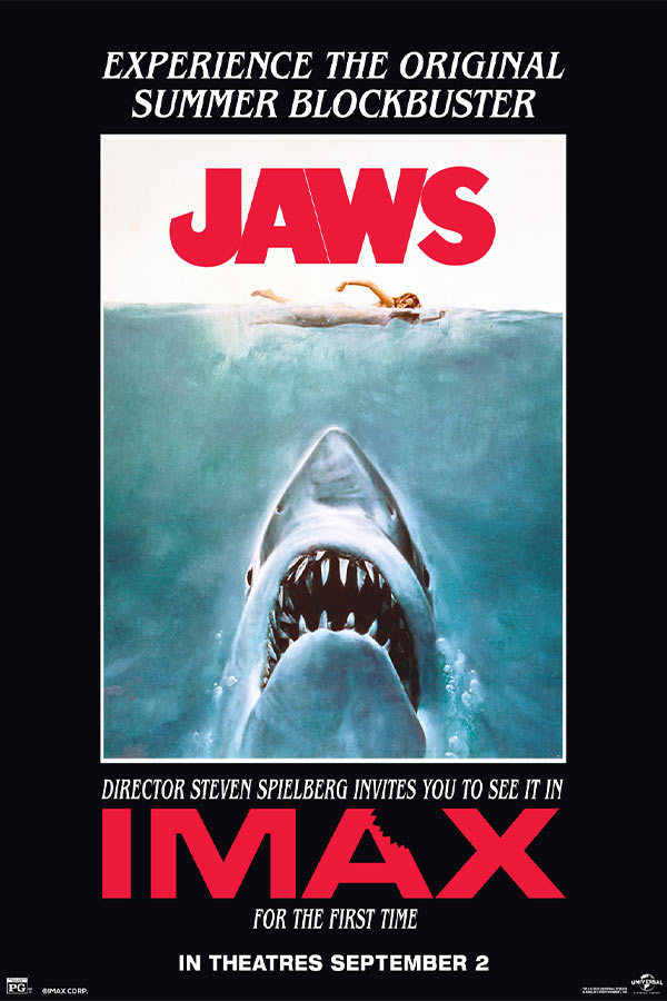 film poster for "Jaws" of a large shark coming out of water, a woman is swimming on top of the water