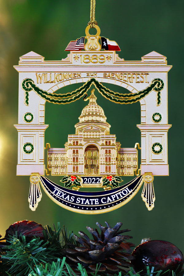 an ornament of the Texas State Capitol hanging on a Christmas tree