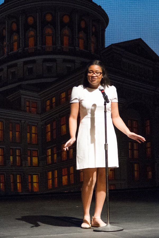 Poetry Out Loud contestant standing in front of a microphone