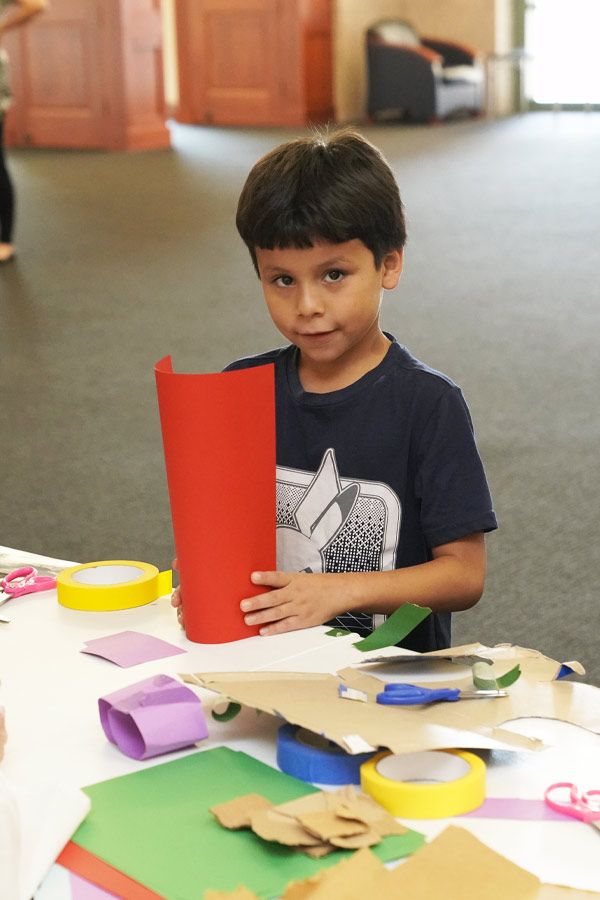 A child doing a paper craft activity at the Bullock Museum.