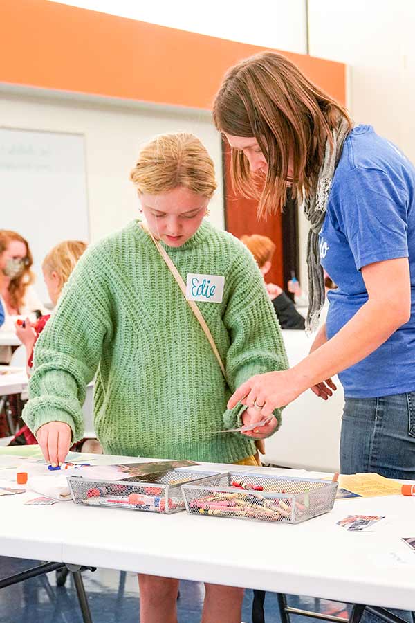 two girl standing at a craft table at the Bullock Museum