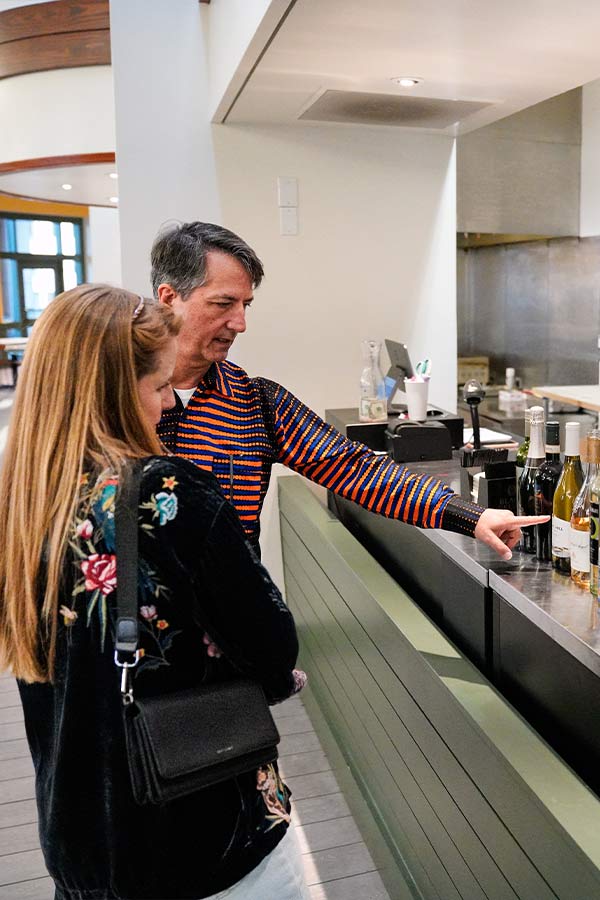 two adults looking at alcoholic beverages in The Star Cafe in the Bullock Museum