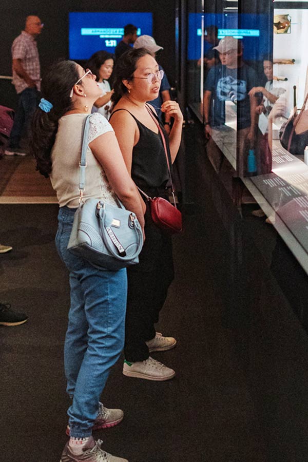 two people holding looking at an exhibit at the Bullock Museum