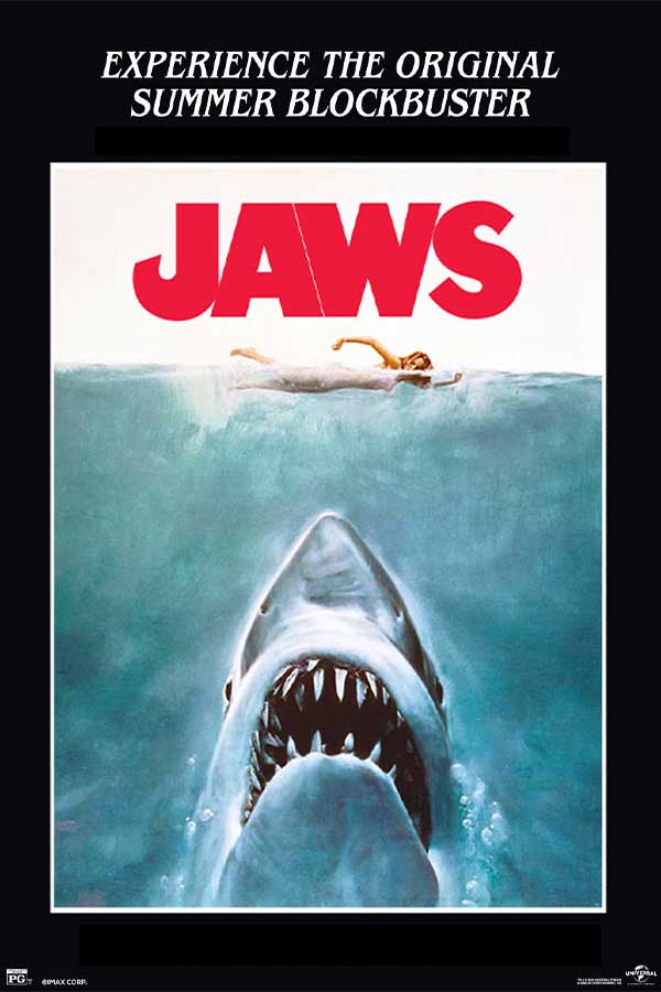 film poste for "Jaws" of a shark coming up out of the water while a woman swims on top