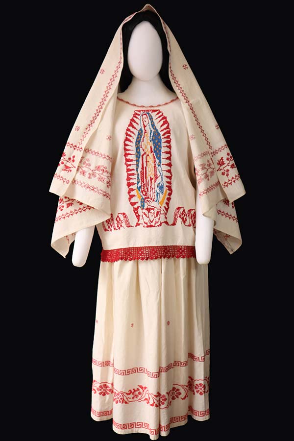 traditional Mexican dress from Colima with an embroidered with an image of the Virgin of Guadalupe