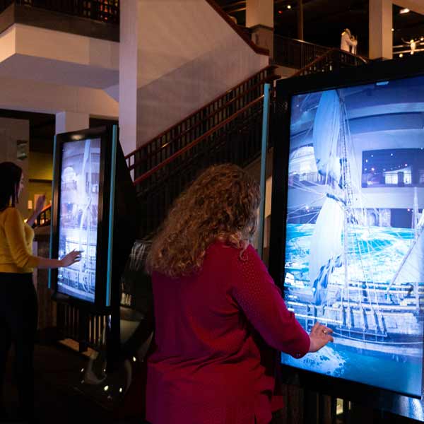 Touch screen monitors placed throughout the Museum allow exploration of what life was like sailing aboard <em>La Belle</em>.
