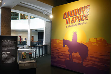Intro wall of Cowboys in Space with a large image of a cowboy on a horse on a distant planet