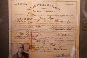 A close-up image of an aged document in an artifact case at the Bullock Museum