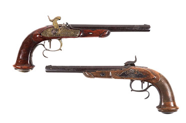 front and back of an 1830s pistol with detailed engraving on the handles
