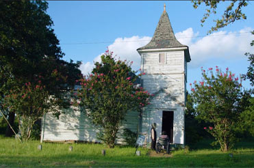 white church, Dabney Hill Missionary Baptist Church surrounded by overgrown grass