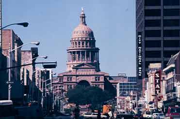 a downtown view of Congress St and the Texas State Capitol in the 1970s