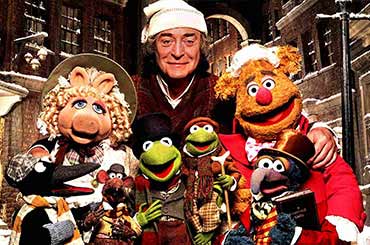 muppets and Scrooge from the Muppet Christmas Carol standing in a group