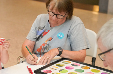 A woman doing a craft.