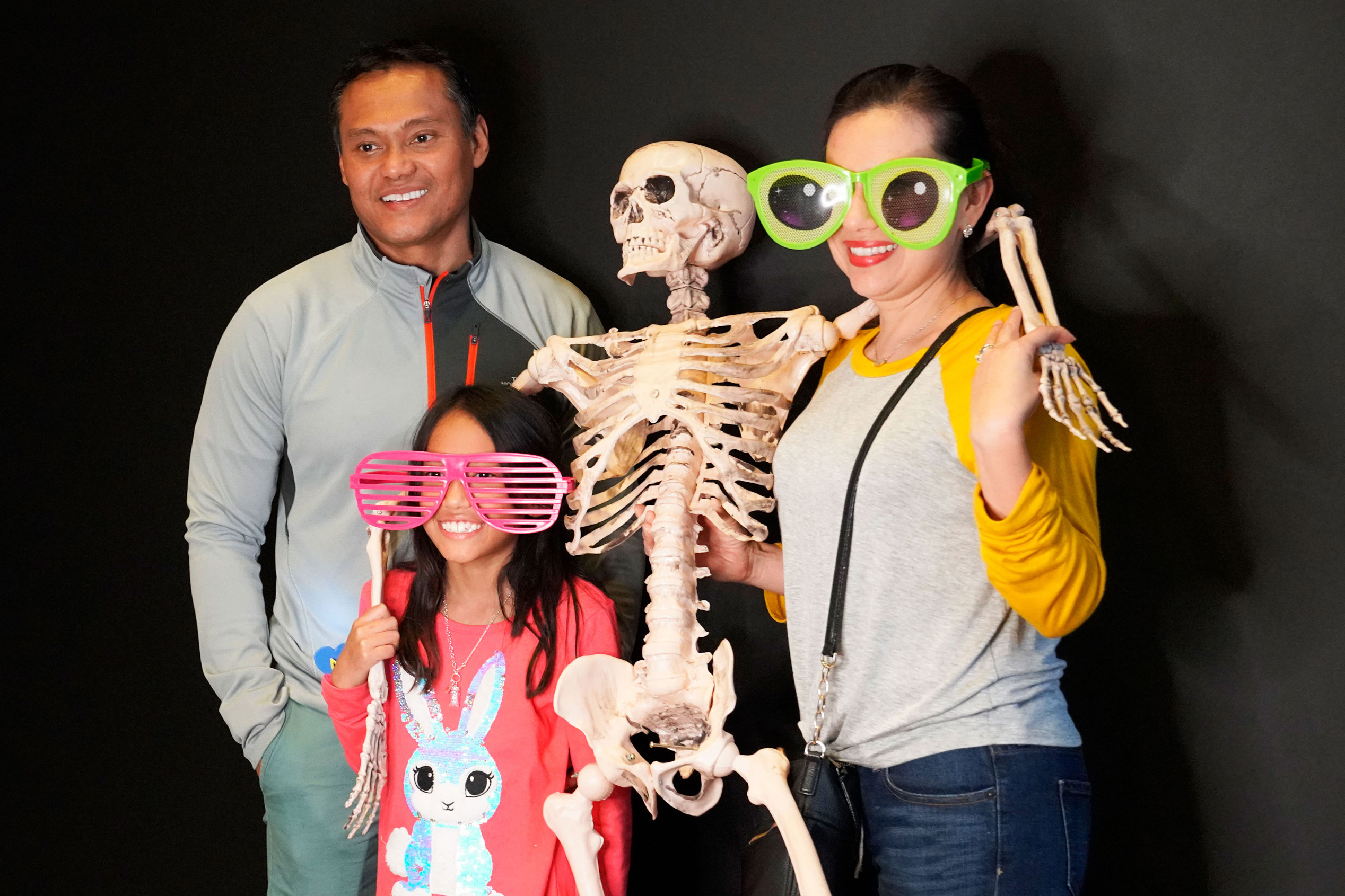 Families strike a spooky pose with Say Cheese photobooth during Spooktacular at the Bullock Museum.