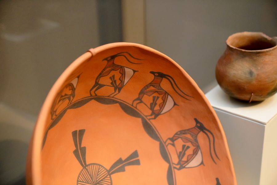 closeup of brown earthenware bowl and pot on display