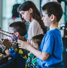 Children interacting with mechanical controller