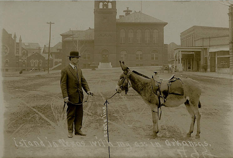 Man in Texas and his ass in Arkansas postcard